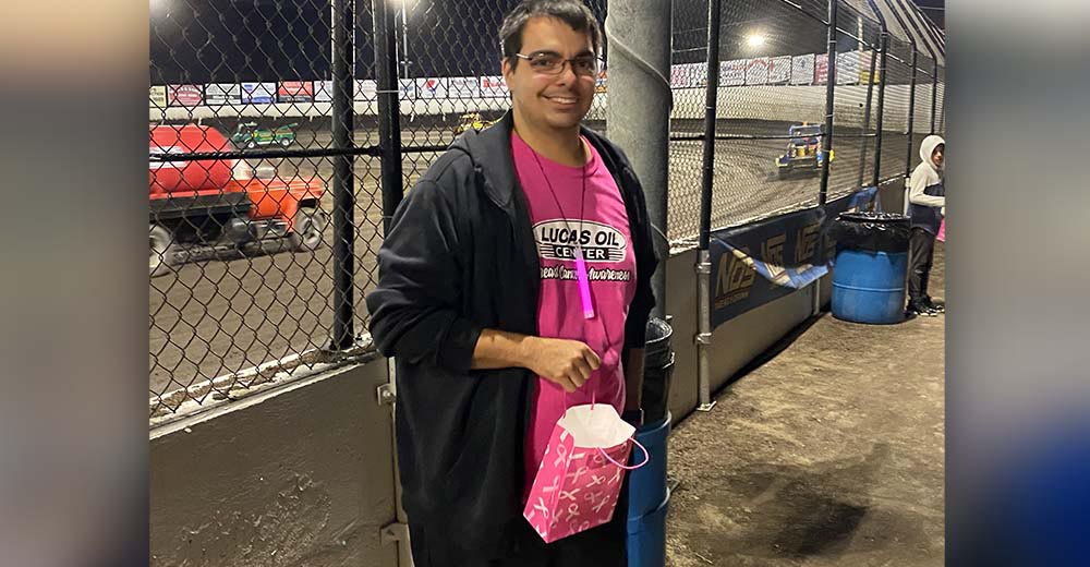 Training Manager Matt Harter taking donations at Tri-State Speedway for Breast Cancer Awareness Month.